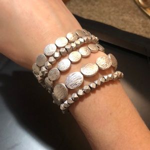 A set of silver beaded bracelets